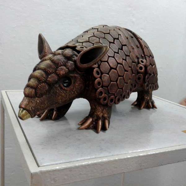 Fired ceramic with a patina, metal and painted eggshell - L 50 x W 20 x H 18 cm