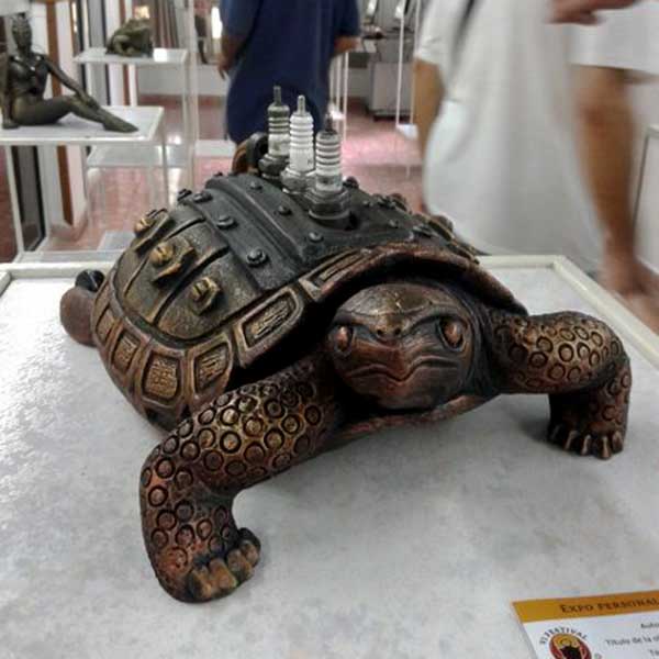 Fired ceramic with a patina, metal and painted eggshell - L 35 x W 23 x H 17 cm